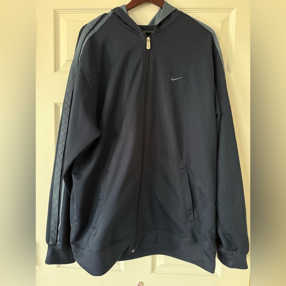 Nike hoodie size XL in navy with pattern on the sleeves